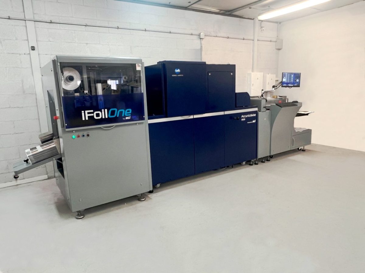 Industrial foil stamping machine (iFoilOne) in a clean manufacturing room.